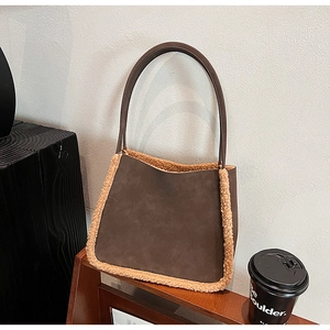 Brown suede tote bag with plush faux shearling trim and slim leather shoulder straps