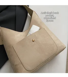 Detail view of the soft PU leather shoulder bag featuring a secure magnetic back pocket