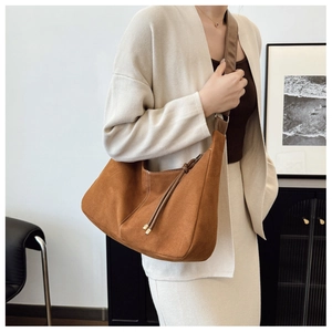Brown vintage hobo tote bag shown on model highlighting large capacity and matte finish
