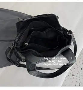 Top view of large black PU leather bag with multi-layer internal compartments and pockets