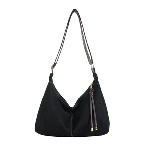 Retro black canvas hobo bag with large capacity, brown leather straps and white stitching
