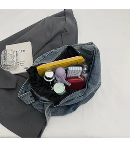 Overhead shot of vintage blue denim tote bag interior showing large storage capacity