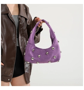 Purple hobo shoulder bag with silver stud detailing and a soft suede texture finish