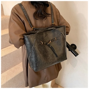 Chic retro oil wax leather tote bag with vintage metal buckles and large capacity detail