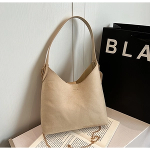 Fashionable beige PU leather tote bag with gold chain strap and elegant suede finish