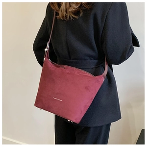 Detail view of burgundy soft PU leather hobo bag with Fashion & Bags logo and shoulder strap