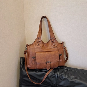 Retro brown PU leather tote bag with buckle flap pocket and adjustable shoulder strap