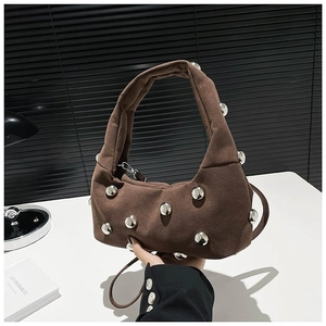 Brown suede crescent bag with metallic silver studs and adjustable shoulder strap