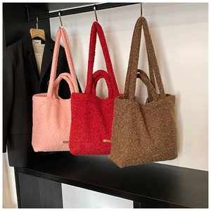Winter plush tote bags in pink, red, and brown with double handles and soft texture