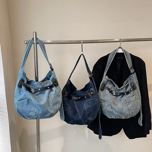 Fashionable denim hobo bag set in three washes with belt buckle and rivet details