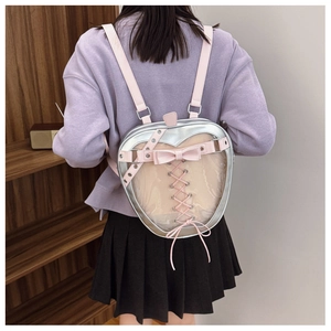 Detail view of apple-shaped silverita bag with pink straps and transparent window