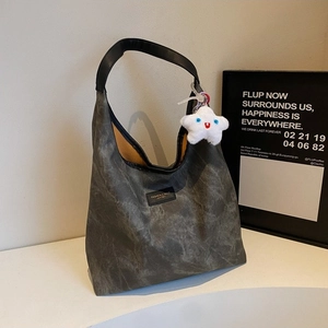 Fashionable dark grey washed tote bag with black strap and star plush pendant