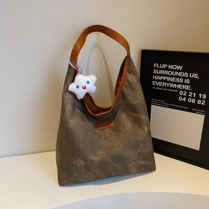 Retro mocha shoulder bag with washed canvas texture and cute white cloud pendant