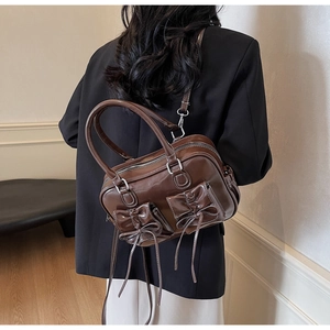 Back view of brown oil wax leather handbag with stylish bow knots and double pockets