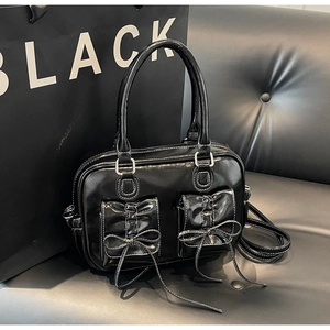 Retro black patent leather square handbag with bows and white stitching details