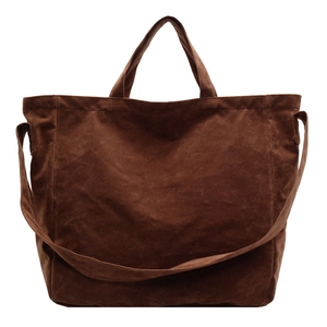 Deep brown matte faux leather tote bag with dual handles and long shoulder strap
