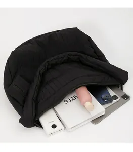 Top view of spacious black pleated tote bag showing organized interior storage capacity