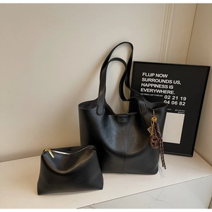 Minimalist black PU leather tote bag set with matching small zipper pouch and logo charm
