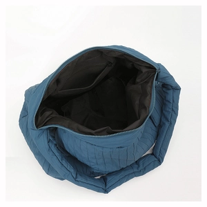 Top view of large capacity quilted tote bag showing interior zipper pocket and dark lining