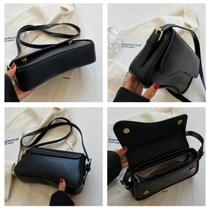 Detail view of black matte saddle bag showing magnetic closure and internal compartments