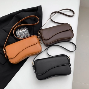 Minimalist underarm flap bags in brown, coffee, and black with wave design and gold hardware