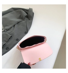 Detailed interior view of a pink PU leather chain bag with gold metal rotating lock
