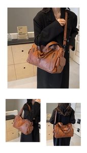 Detail view of large brown vintage tote bag with functional pockets and adjustable strap