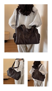 Detail view of large dark brown tote bag with textured leather and dual front zippers