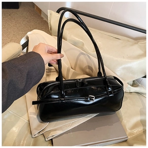 Glossy black patent leather baguette bag with silver buckle and thin shoulder straps