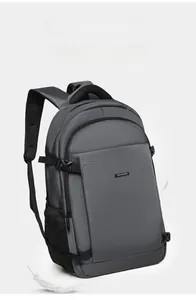 Detail of grey lightweight business backpack showing breathable straps and water-resistant fabric