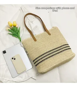 Straw tote bag showing large capacity with iPad and phone comparison on a white cloth