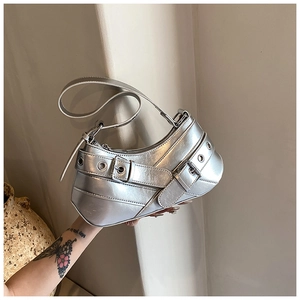 Silver metallic underarm bag featuring y2k biker style belt buckles and punk hardware detail