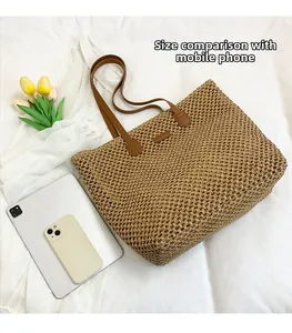 Top view of large straw tote bag with phone and tablet showing high capacity detail