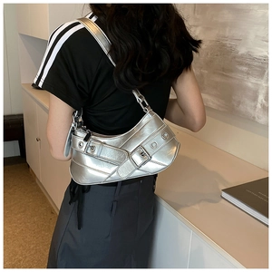 Silver metallic y2k shoulder bag with vintage buckle detail and grommet hardware accents