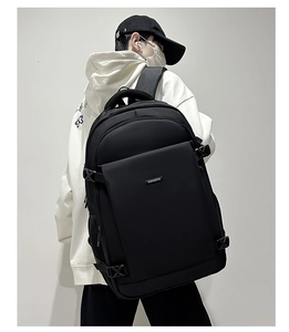 Black large-capacity business backpack with breathable shoulder straps shown on a model