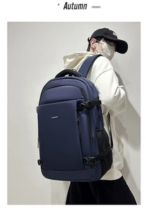 Detail view of large capacity dark blue business backpack with durable mesh side pocket