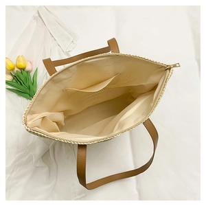 Top view of woven beach tote bag showing spacious fabric lining and inner pockets