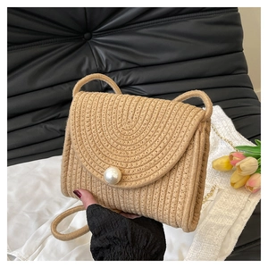 Summer handmade straw crossbody bag with large pearl clasp and woven shoulder strap