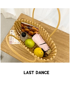 Top view of yellow woven tote bag showing spacious interior with magazine and umbrella