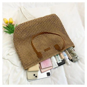 Top view of spacious straw tote bag showing interior storage for daily essentials