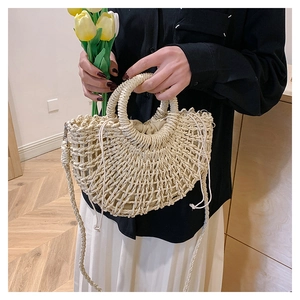Fashionable straw woven crescent bag with circular top handles and drawstring inner pouch