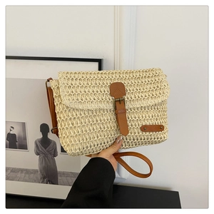 Handmade woven straw crossbody bag with brown leather strap for summer beach fashion