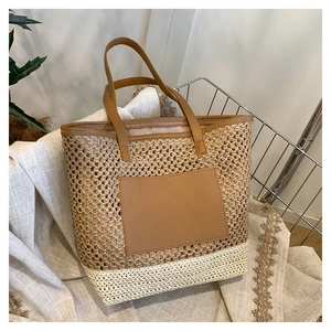Fashionable woven paper rope tote bag with leather pocket and contrast stitching detail