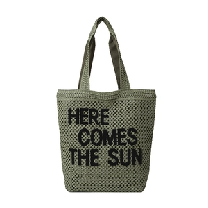 Green knit tote bag featuring Here Comes The Sun embroidery on a white background