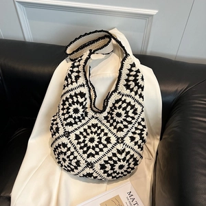 Handmade crochet hobo bag with black and white grandmother square pattern for women