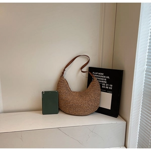 Brown woven hobo shoulder bag for women with large capacity shown with tablet