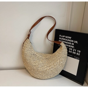 Straw hobo shoulder bag with brown leather strap and elegant crescent moon design