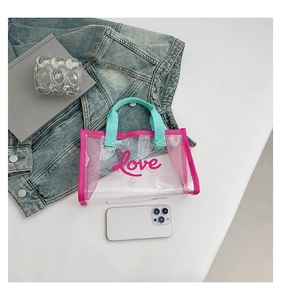 Detail of transparent mesh tote with pink Love print and blue straps on casual setting