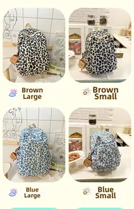Detail view of leopard print backpacks in brown and blue colors with plush toast charms
