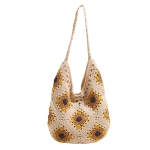 Handmade crochet shoulder bag featuring sunflower patterns and bohemian hollow knit design
